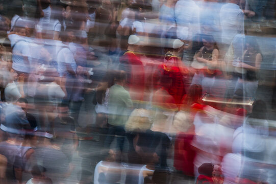 Tirane, Albania - 03 June 2026: View of a blurred crowd of people during a protest with motion effect and abstract figures in the city center.