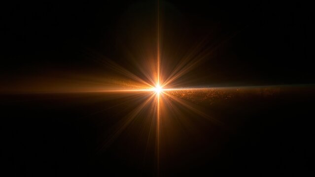 Glowing light burst with star flare on dark background