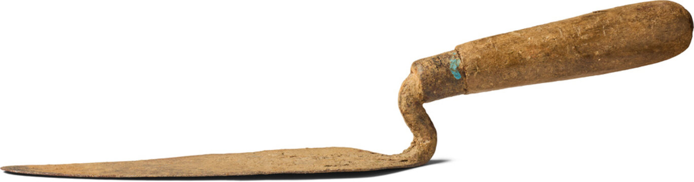 old rusty masonry trowel isolated white background, wooden handle and weathered metal blade building tool in side view