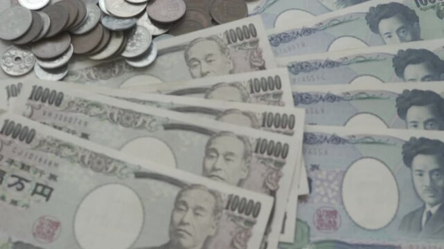 Japanese Yen money. close up of the Japanese yen on hand. currency of Japan that is used to change, buy, sell, accumulate, invest, financial, exchange rate, value, accounting, international exchange
