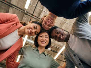Fototapeta premium Generative AI, Four Diverse Colleagues Huddling Together Smiling Down at Camera in Office