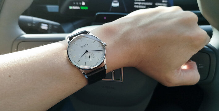 BANGKOK, THAILAND - MAY 7 : Nomos Orion, Germany made watch, manual winding mechanic, white silver dial with small second, minimal design, in Bangkok, Thailand, on May 7, 2026.