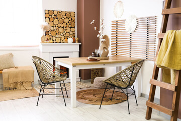 Obraz premium Interior of stylish dining room with table, fireplace and ladder