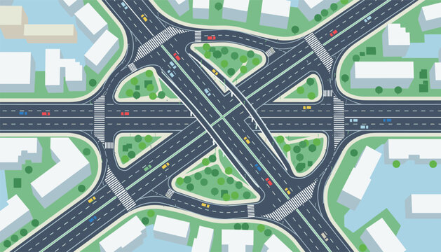 Top down aerial view of a busy city highway junction with multiple lanes driving cars and surrounding white buildings.