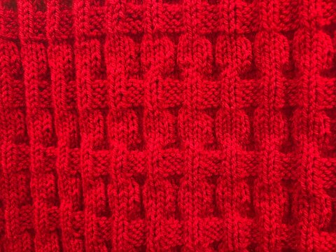 close up of red knit pattern 