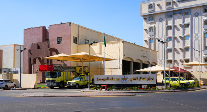 Civil defense fire station with lime yellow fire trucks and rescue vehicles in Taif, Saudi Arabia