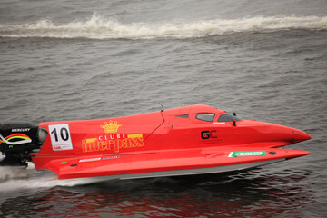 Naklejka premium July 22, 2012 – Kyiv, Ukraine: Amazing high-speed Formula 1 powerboat from Team Sweden racing across the water surface during a thrilling international motorsport event