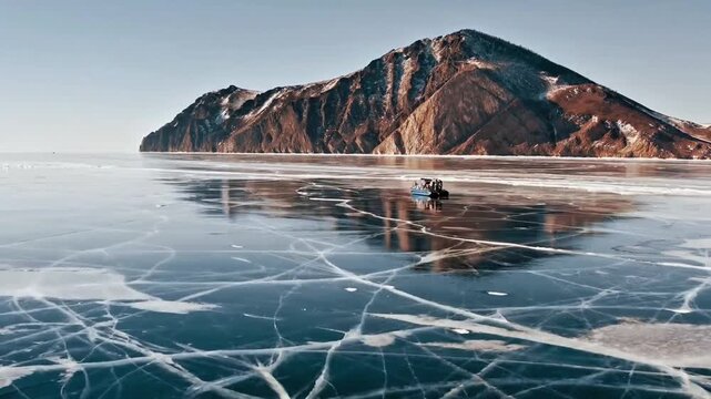 Hovercraft crossing a vast frozen lake with mountain background