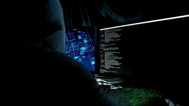 Credential Stuffing Male Hacker Working on Computer to Bypass Account Security Database in 4K Ultra HD footage

