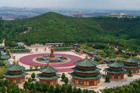 The Huayan Fountain Square and the Pilu Palace in the Nanshan scenic area of the Jiaodong Peninsula on a sunny summer day, Longkou, Yantai, Shandong, China