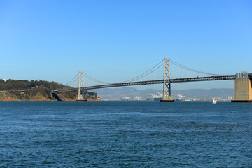 Obraz premium San Francisco - Oakland Bay Bridge is a bridge spanning San Francisco Bay and connecting city of San Francisco and Oakland, California CA, USA. 