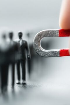 Magnet Attracting Human Figures - Conceptual Image of Influence and Persuasion in Business