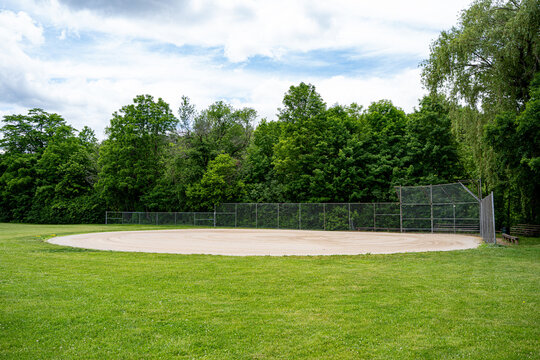 Baseball field backstop and bleachers in public park.