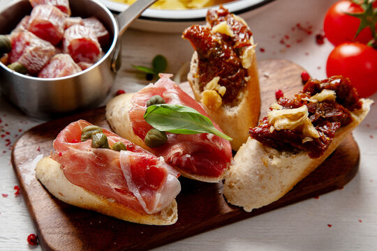 Italian cuisine. Pasta, pizza, olives and antipasto toasts.