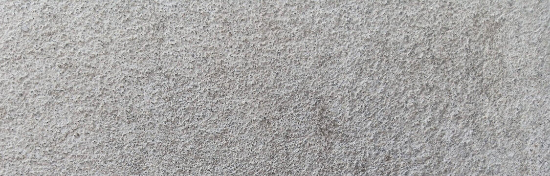 Light gray felt texture background, soft wool fabric material close-up, neutral grey textile surface for craft and fashion design backdrops
