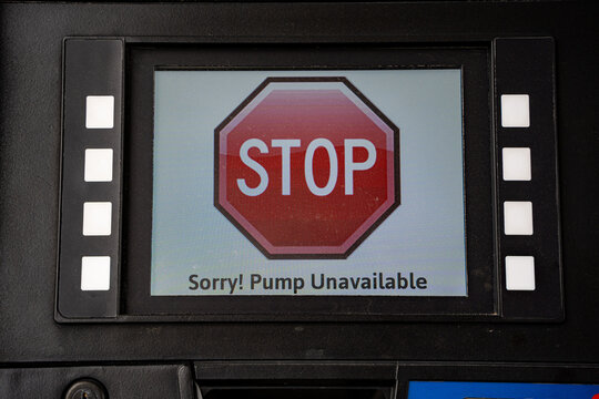Close up of pump unavailable warning on fuel dispenser screen.