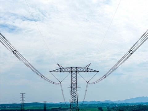 Perspective view of successive high voltage transmission tower group, distant scenery of power transmission for fishery-solar pv & energy storage station