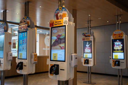View of self-service ordering kiosks inside McDonald's restaurant. Halton Hills, Canada - June 15, 2026.