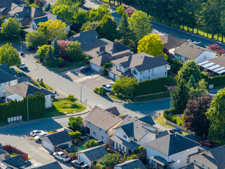 Fototapeta premium Aerial View Of Promontory Suburban Neighborhood In Chilliwack, British Columbia, Canada With Tree-Lined Streets