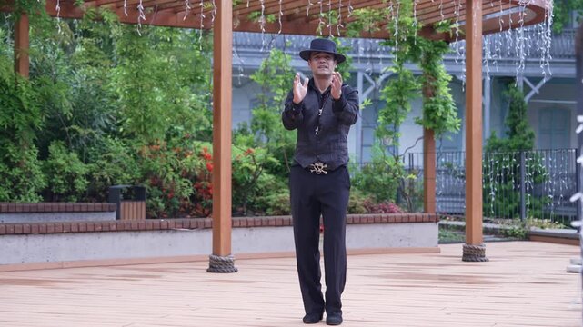 The flamenco dancer is a man. Portrait of a Spaniard. Arm Movements Palmas