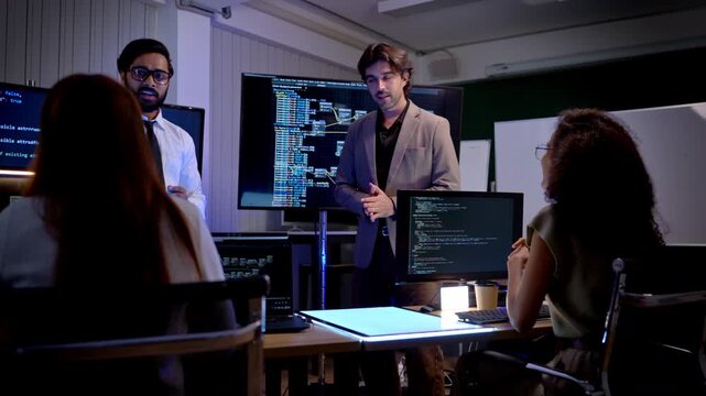 Multicultural business and engineering team discussing software development strategy and digital system planning in futuristic technology workspace