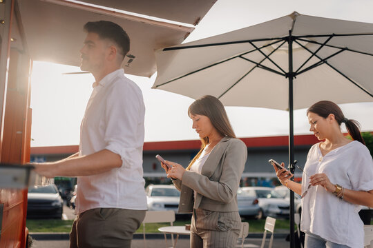 People waiting in line at food truck