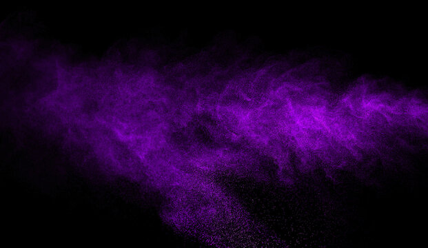 purple dust smoke isolated on a black background. abstract neon, thick swirling, and powder creating a psychedelic light design. smog effect, dark background