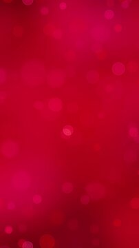 abstract red bokeh lights particles falling animation, valentines day,new year and christmas soft blank vertical social media motion background