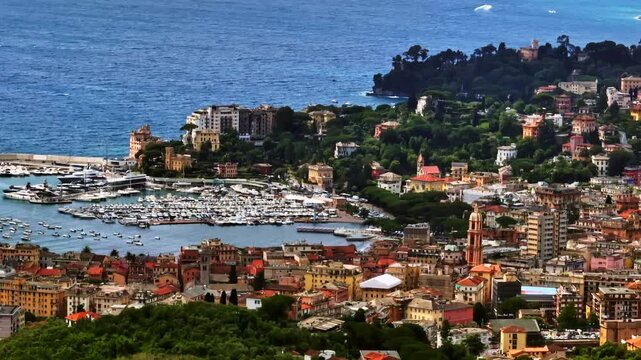 Telephoto drone shot of the Italian Riviera resort town of Rapallo, sunny day
