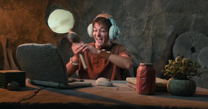 Funny Caveman on Video Call Wearing Headphones and Talking into Prehistoric Stone Axe