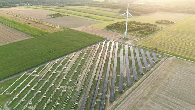 Solar panels installation near wind power turbine