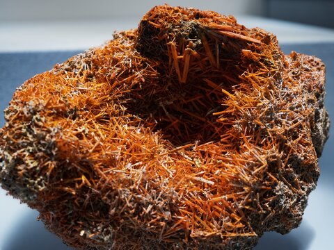 Cluster orange needle form Crystal geology mineral Natural abstract background 