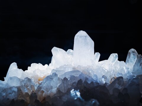 Quartz crystal cluster Natural abstract background close up glow lighting