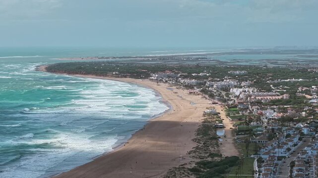 Playa de la Barrosa Chiclana de la Frontera popular coastal destination in Spain aerial drone