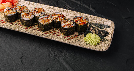Unagi maki sushi rolls with wasabi and ginger © AntAlexStudio