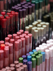 Fototapeta premium Display in the cosmetic shop with a lot of cosmetic samples for make-up.