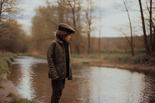 Child Boy Wearing Tweed Caps In Rustic English Countryside Setting