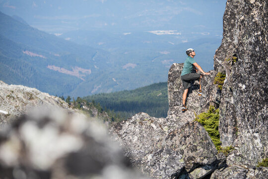 Man climbing a rock face in the mountains