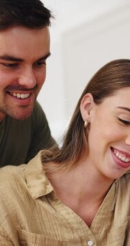 Tablet, scrolling and couple in home with texting, social media or funny meme on app in living room. Happy, digital technology and man with woman for reading comic blog online together in apartment.