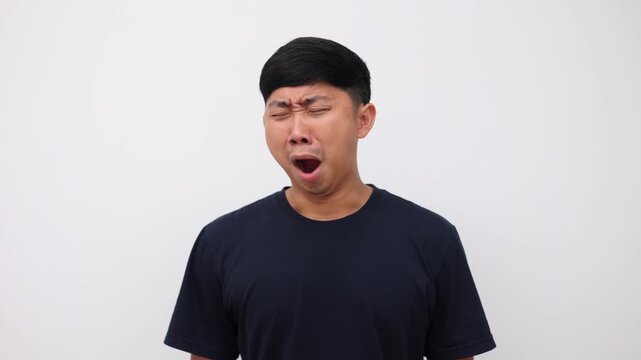 Asian man yawn and feeling sleepy isolated