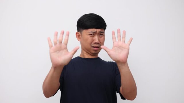 Man show hands up gesture surrender feeling scared portrait slow motion
