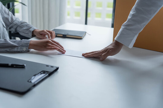 Asian office worker informs HR of resignation