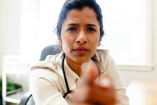 Female medical practitioner with look on concern on face