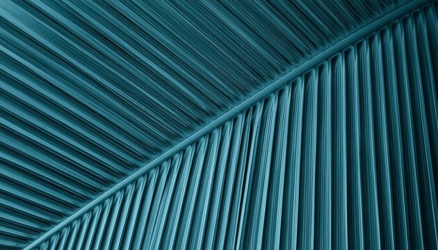 Macro abstract background of pleated teal blue palm frond leaf texture with geometric parallel lines.