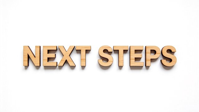 Wooden letters spelling next steps