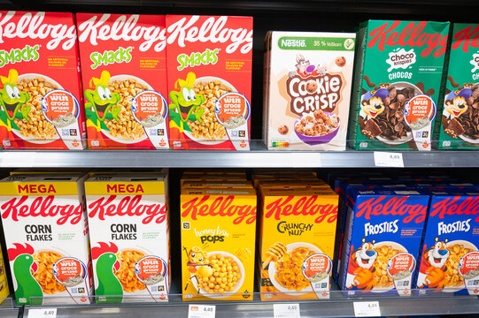 Kellogs cereal muesli assortment, honey, nuts and corn flakes flavour at store shelf, supermarket in Trier, Germany