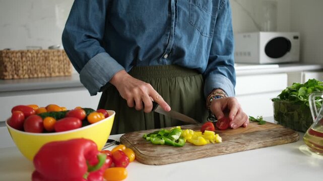Woman Cutting Tomato For Salad