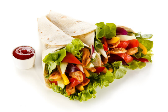 Kebab - grilled meat and vegetables on white background
