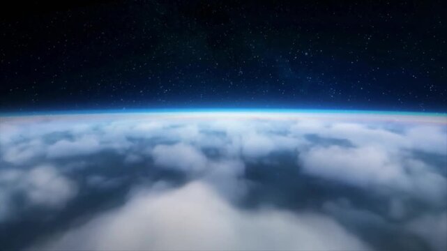 Aerial view of fluffy white clouds covering the earth with a starry sky and thin blue atmospheric line above.