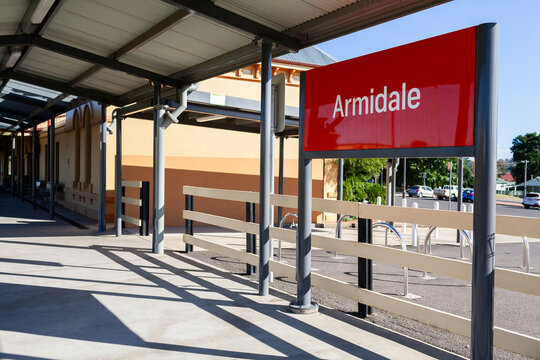 Armidale train station sign at platform